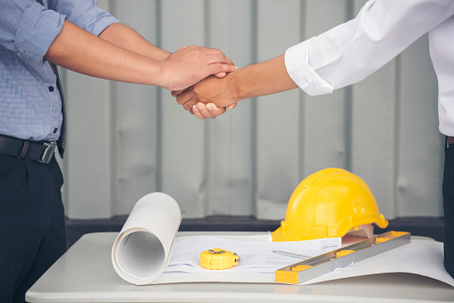 Group of multiracial people Teamwork meeting join hands Engineer Manager Foreman fist bump together. Close up diversity engineer people hands partner teams. Business connection team join partnership