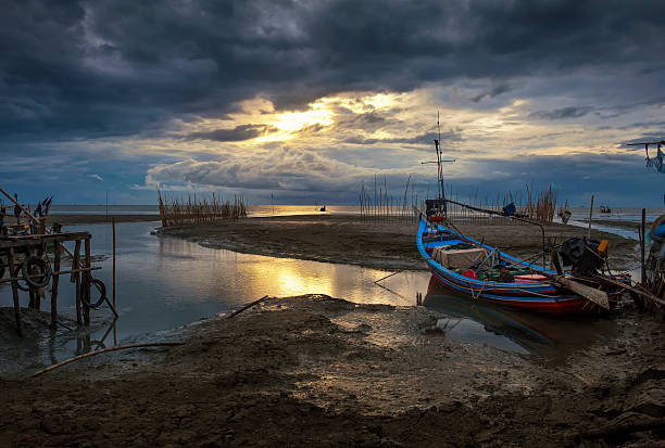 istock Tradition boat and sunrise seascape under blue sky on twilight 179230958