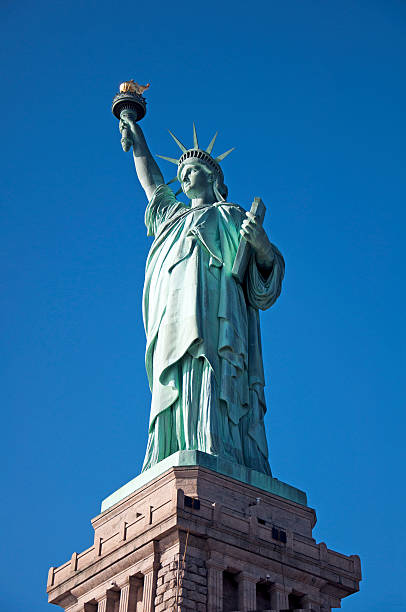 istock Statue of Liberty complete blue sky background 179231153