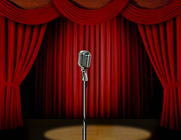 istock Retro microphone and red curtain on stage 179231369