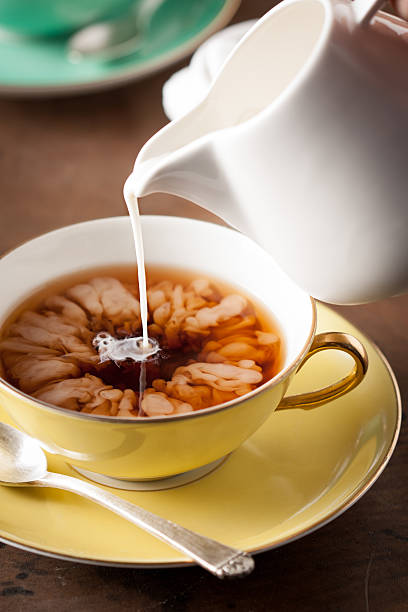 istock Pouring milk on a tea cup 179231667