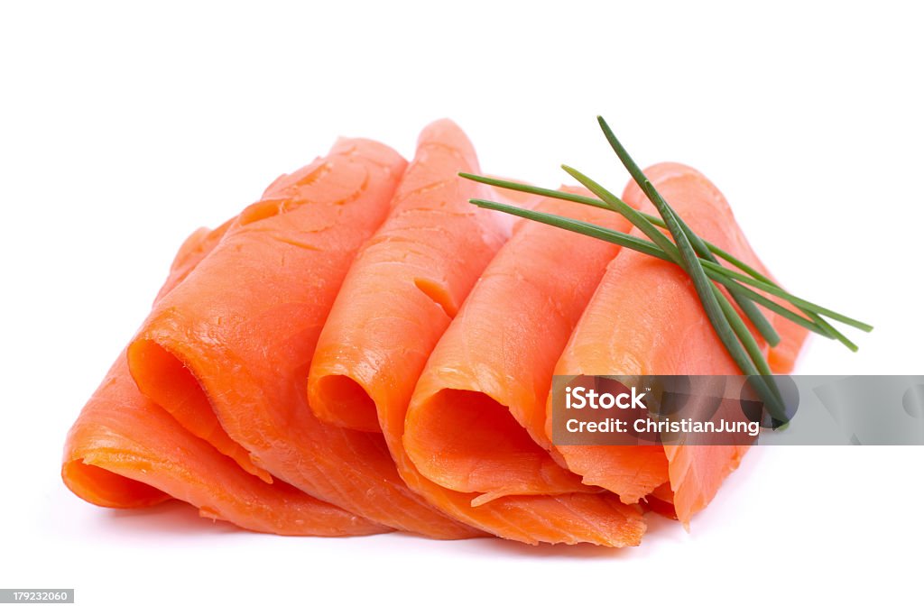 Thinly sliced fresh salmon arranged on white background Fresh salmon on white ground Slice of Food Stock Photo