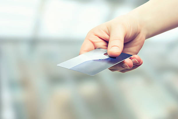 istock hand with bank credit  card 179232287