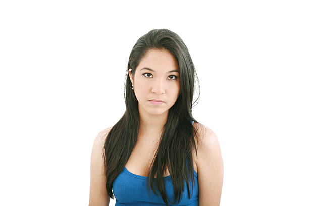 istock pretty young woman with serious face 179232443