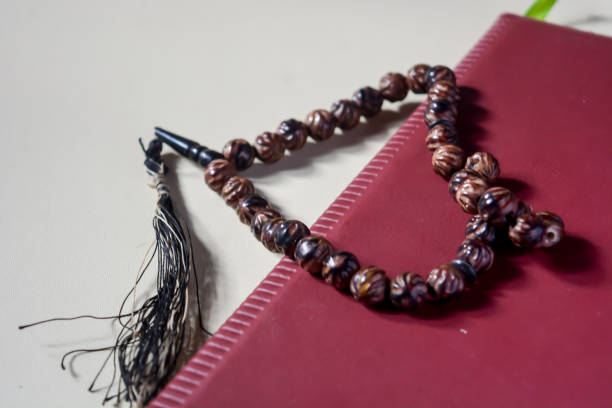 istock Close up view of brown prayer beads on white background. 1792326292