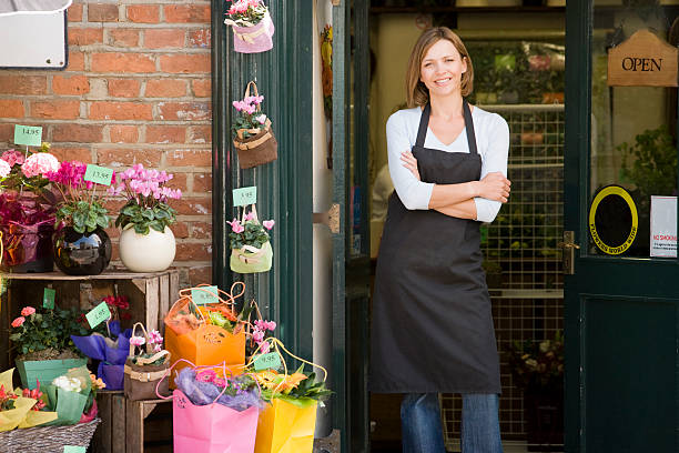 istock Woman working at flower shop smiling 179232875
