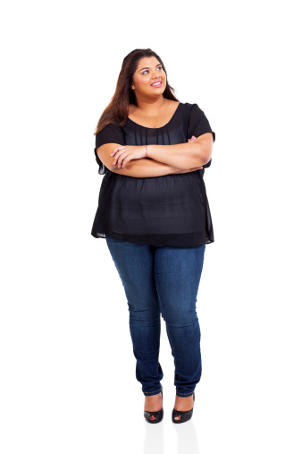 smiling overweight woman looking up isolated on white