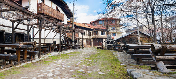 old architecture houses and stone paved road, Bansko, Bulgaria