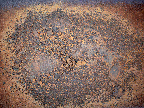 Above view of rusted steel floor. The steel floor was peeling off in sheets in the middle. For background and textured.
