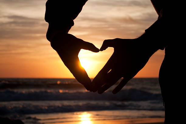 istock Hands forming a heart at the sunset 179234385