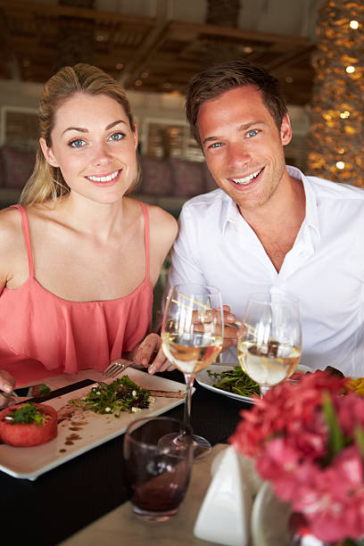 istock Couple Enjoying Meal In Restaurant 179234402