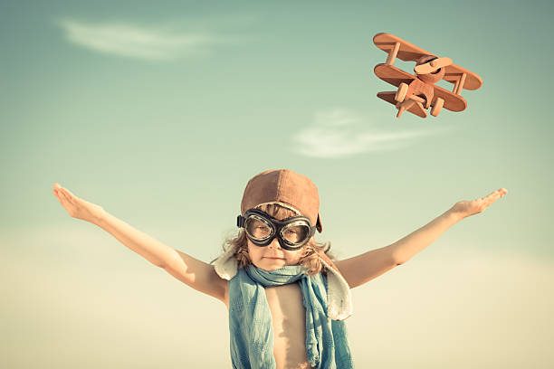 istock Happy kid playing with toy airplane 179234803