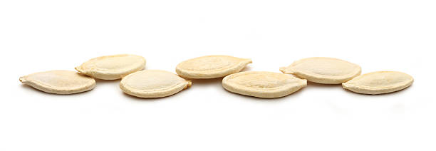 istock Pumpkin seeds on the white background 179235169