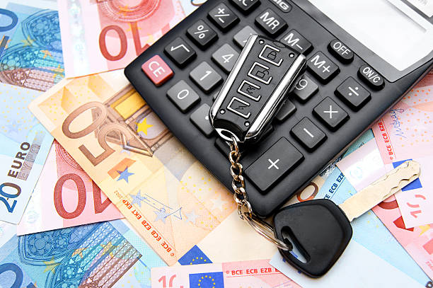 istock Calculators and keys for euro banknotes. 179236006