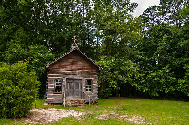 istock old wood log cabin church in forest 179238187