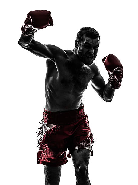 istock one man exercising thai boxing silhouette 179238864