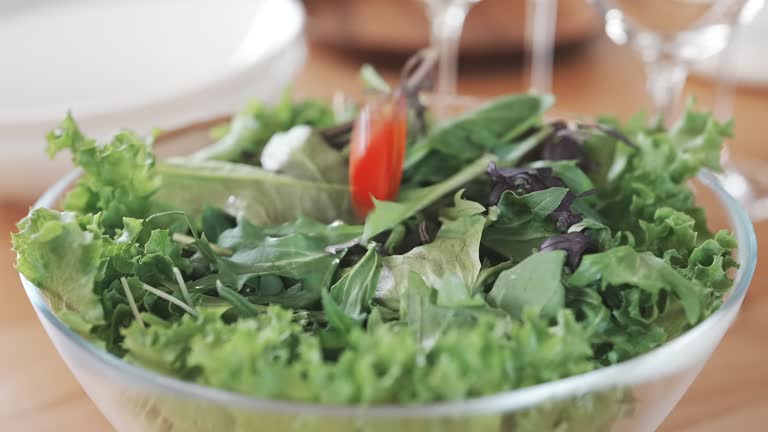 Slow Motion: Placing Tomatoes on Salad