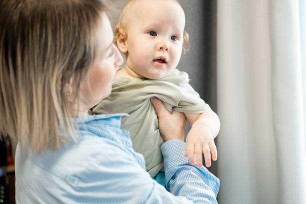 istock Mom holds her son in her arms. 1792395296