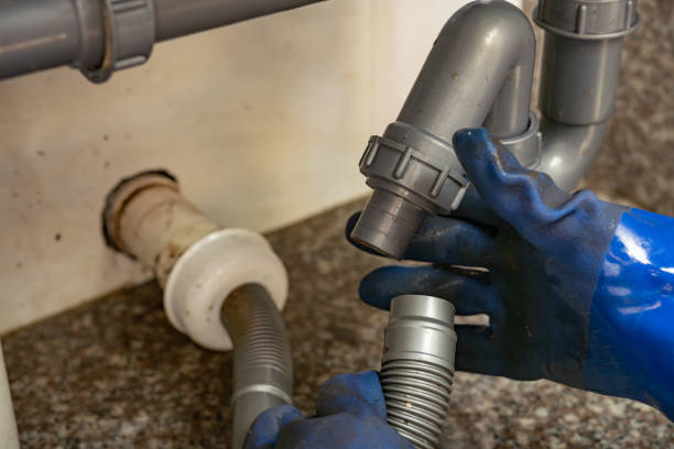 istock plumber checking the drain pipes 1792396847