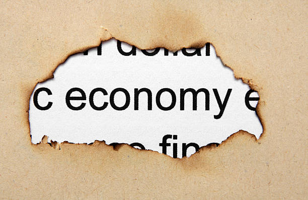 istock Economy text on paper hole 179240575