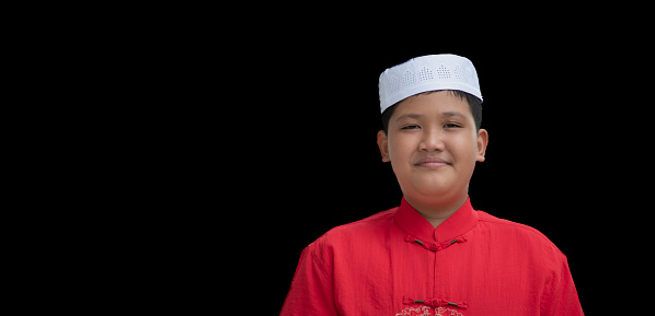 Asian Muslim or Islamic boy isolated on white background with clipping path.