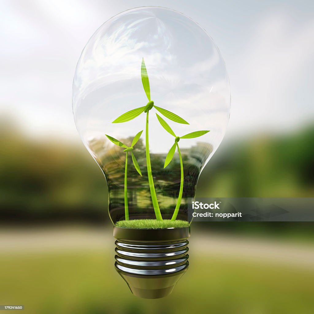 Electric light bulb and wind meels. Electric light bulb and wind meels inside it as symbol of green energy.3d rendering Backgrounds Stock Photo