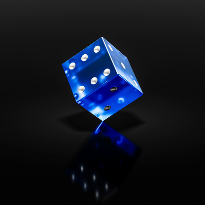 Dices on the black background. Close up.