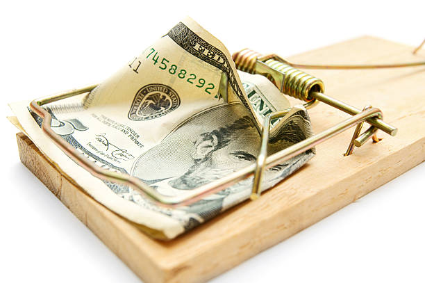 istock Money in a mousetrap. 179242092
