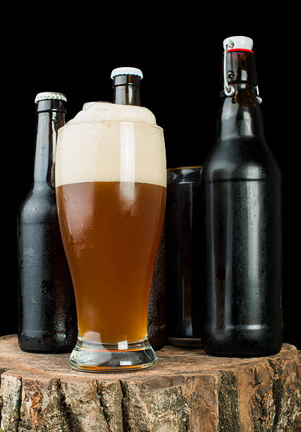 istock Bottles of beer and mug on stump 179242387