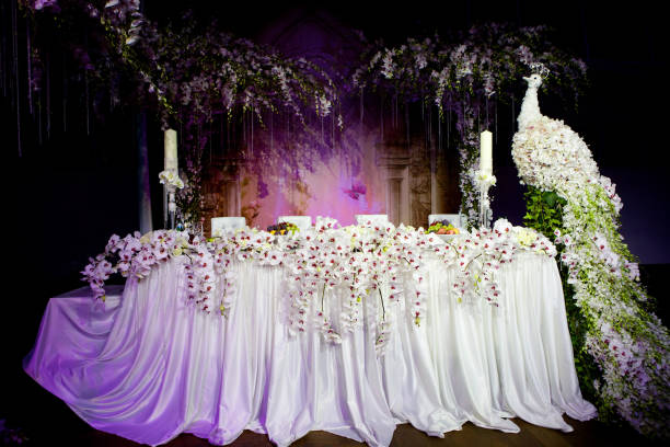 Romantic table setting in a restaurant for relaxation. Wedding decor for newlyweds at a Banquet. Dried flowers Floristics and candles. Restaurant and catering services for the bride and groom.