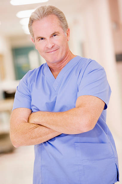 istock Doctor Standing In A Hospital Corridor 179242922