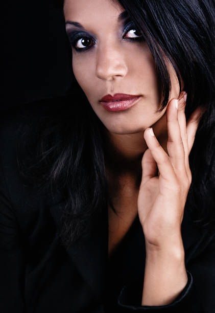 replacement for image 3354393 (cropped version for better composition)Confident Business woman (from middle east) shot on dark background Check out this serie