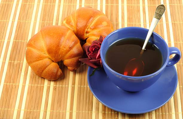istock Tea, croissant and rose 179243519