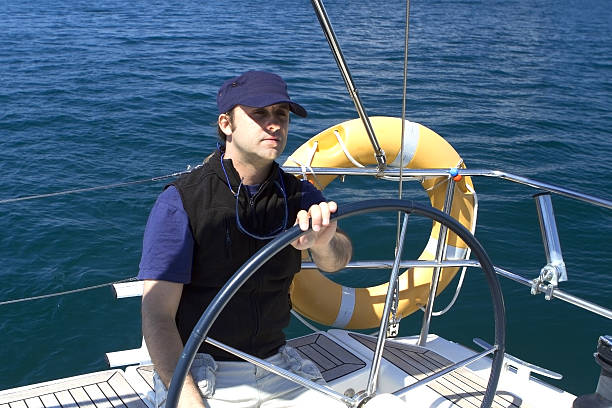 istock Skipper At The Wheel of A sailing boat 179243849