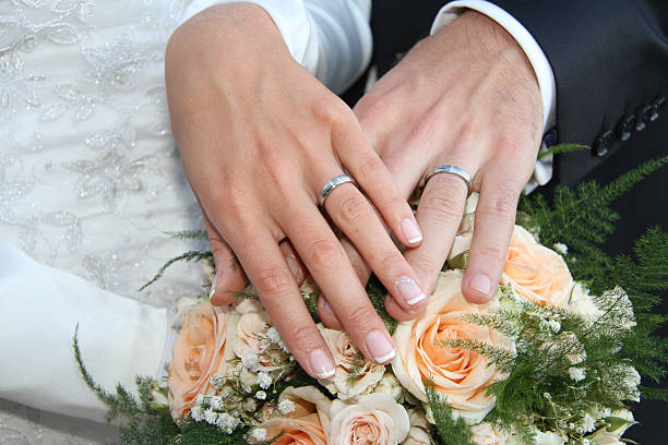 istock Hands and rings on wedding bouquet 179244138