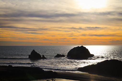 Scenic view of sea against sky during sunset with the Seal Rock at Lands End, San Francisco, USA.