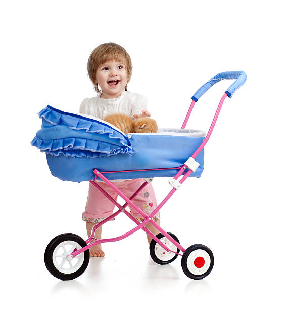 istock happy child girl playing with kitten 179245326