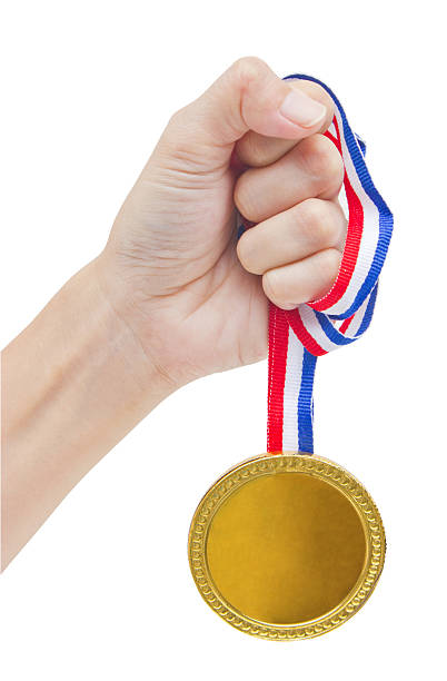 istock Golden medal in woman's hand isolated on white background. 179245614