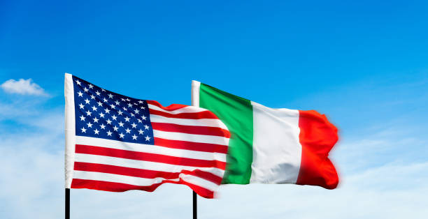 istock USA and Italy flags against blue sky background 1792458173