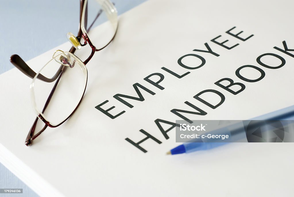 employee handbook employee handbook on blue background Document Stock Photo