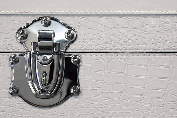 Trunk lock in metal and leather stock photo