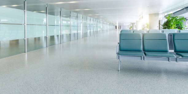 istock Empty airport terminal waiting area with green chairs 1792462484
