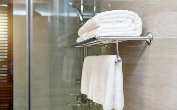 istock White comfortable towels on a hanger prepared to use 1792463557