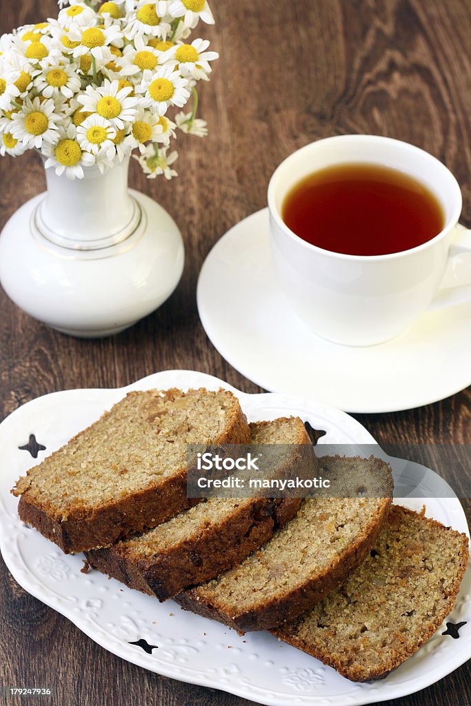 Pattypan cake with raisin Pattypan cake with raisin, sliced on a plate and cup of tea Baked Stock Photo