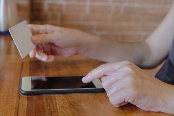 istock Unrecognizable Chinese woman paying bill online using credit card 1792487672