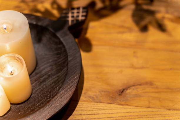 istock empty wooden table and candle light up with copy space. 1792488200