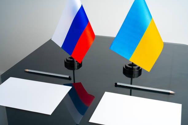 istock Russia and Ukraine flags on negotiation table 1792488713