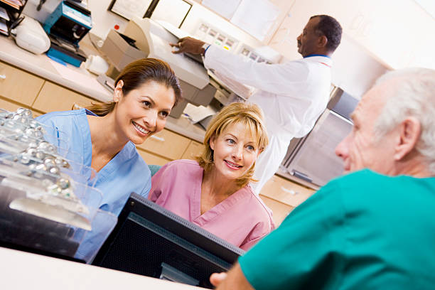 istock Nurses Talking At The Reception Area In A Hospital 179249089