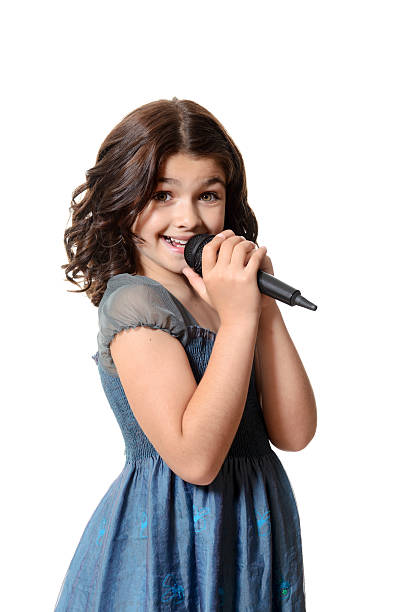 istock happy child singing with microphone 179249207
