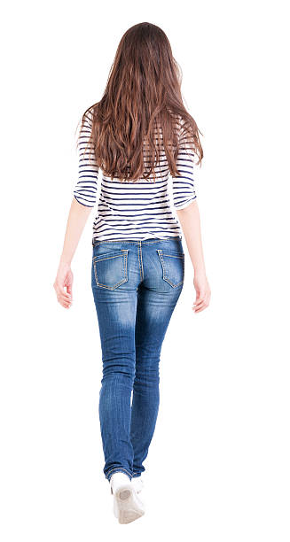 istock back view of walking  woman 179250410